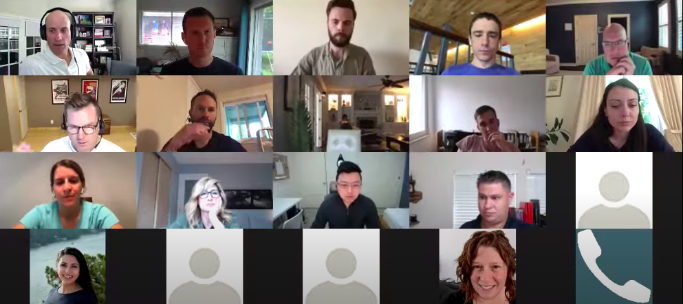 A group of people participating in a team meeting through a video messaging platform.